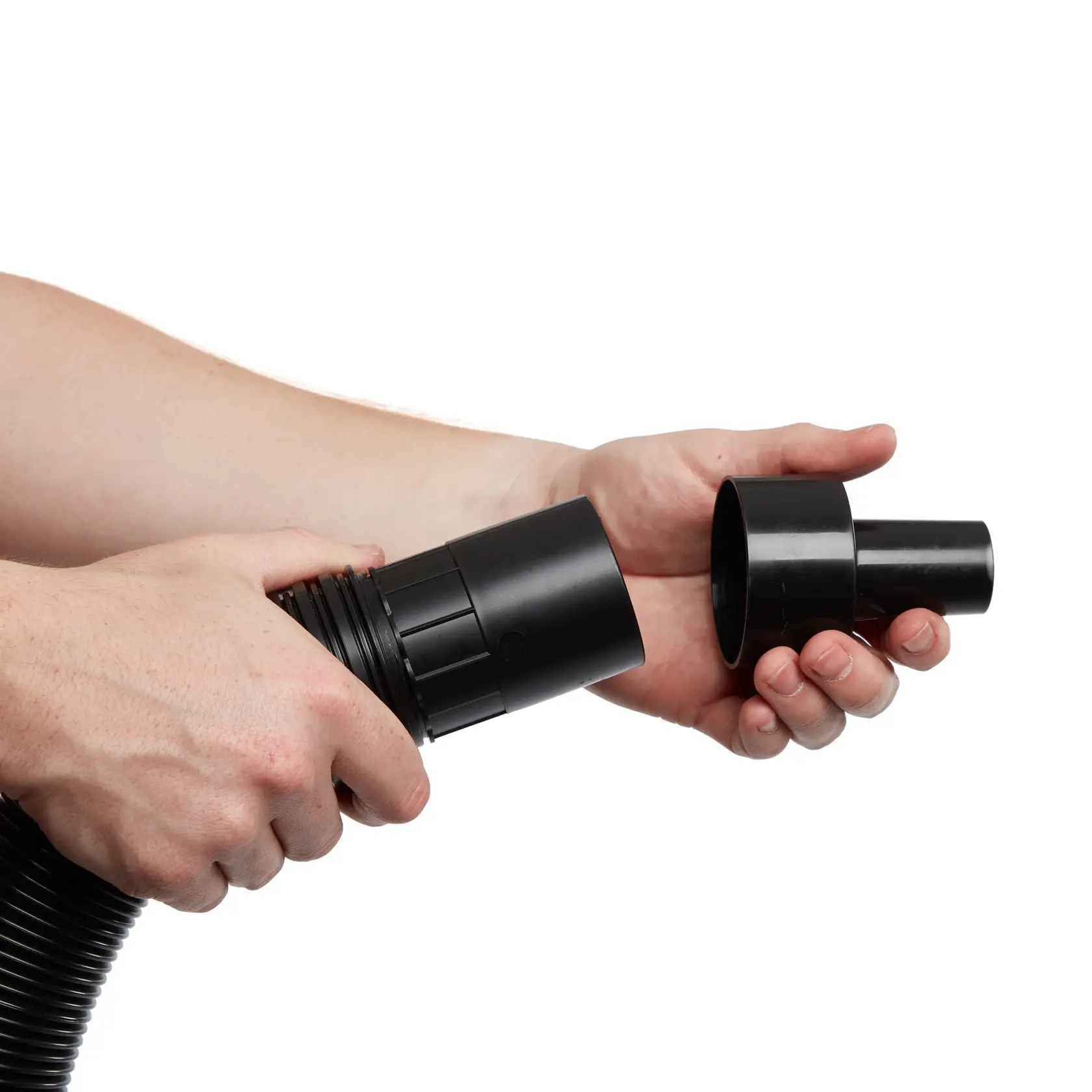 Person attaching the CRAFTSMAN 2-1/2 inch to 1-1/4 inch Adapter to end of a 2-1/2 inch vac hose