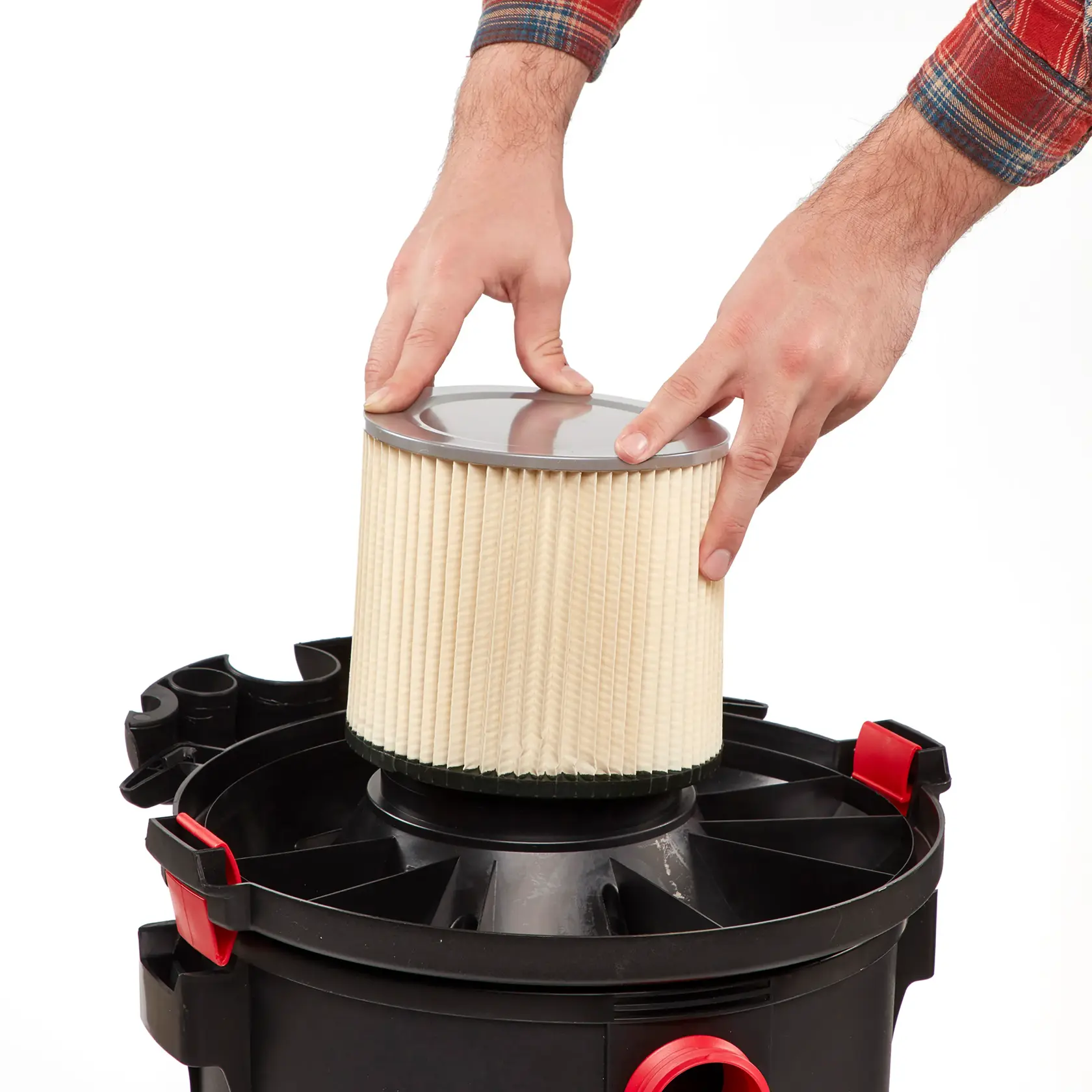 Person installing standard cartridge Replacement Filter onto wet/dry shop vac powerhead