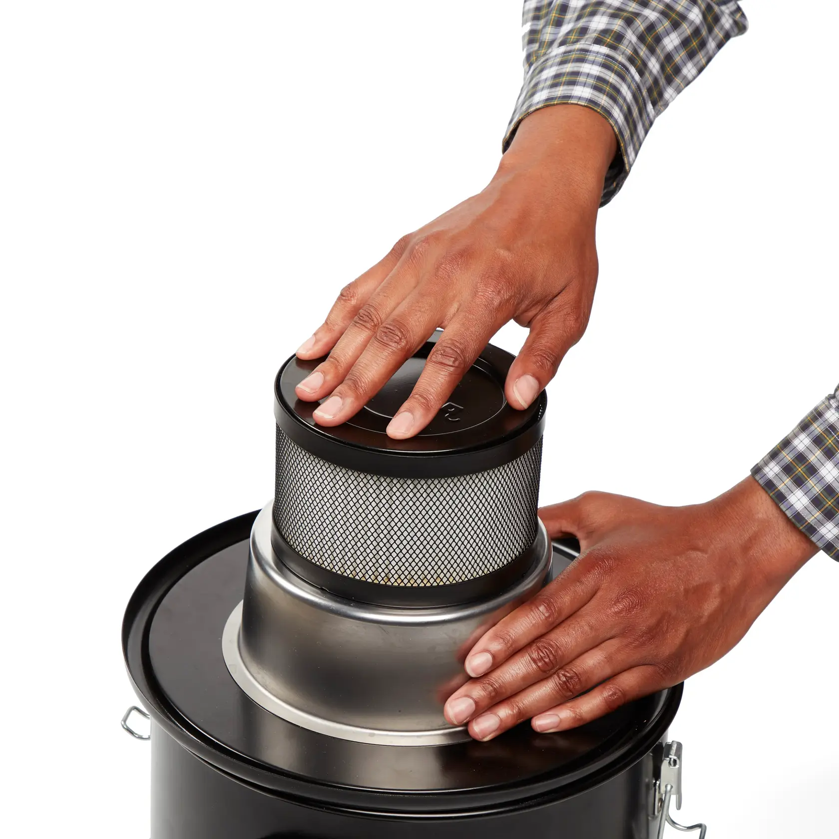 Person securing HEPA Replacement Filter inside filter cage on the CRAFTSMAN Ash Vacuum lid