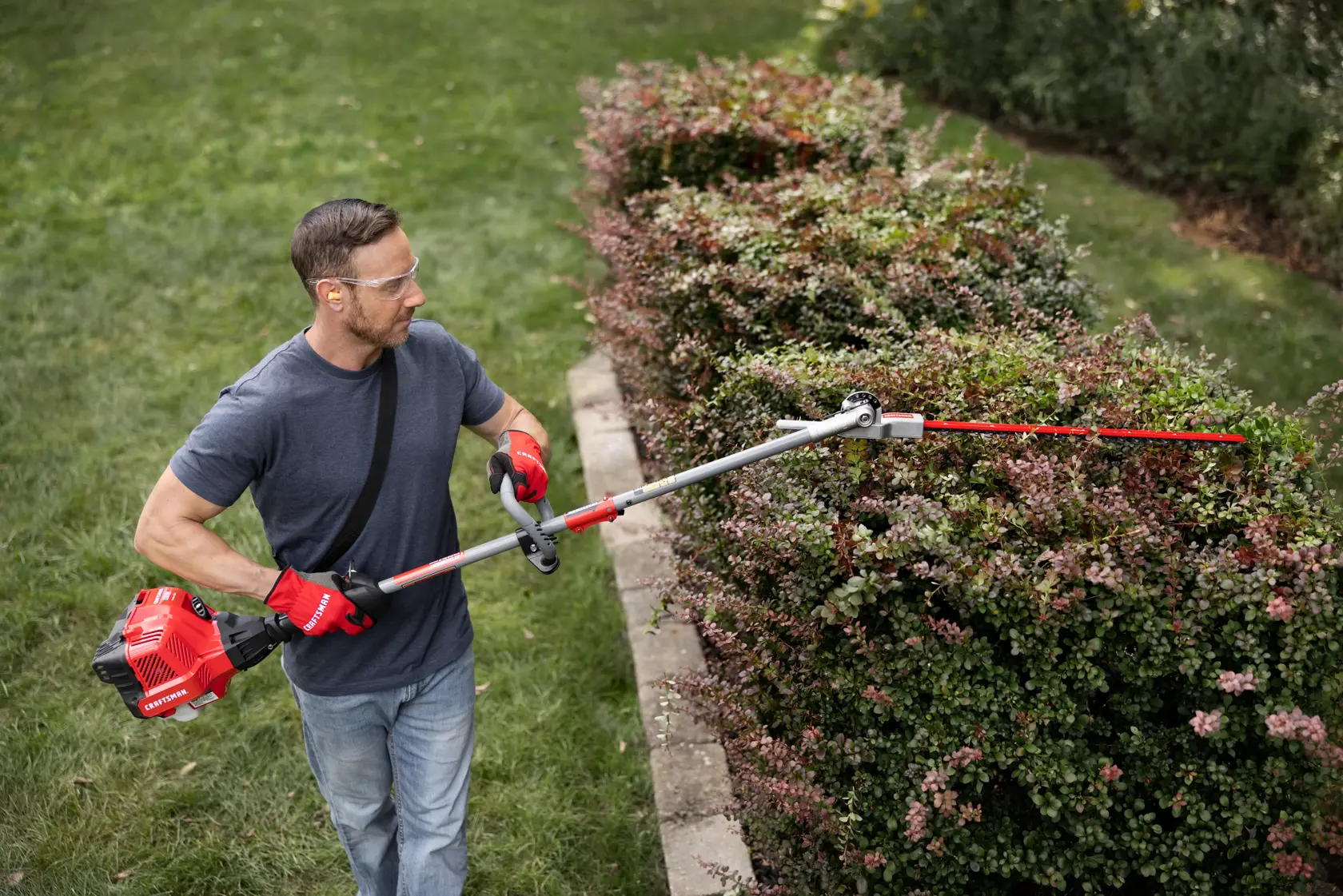 CRAFTSMAN Multi-Tool Attachment Hedge Trimmer cutting sides of hedges