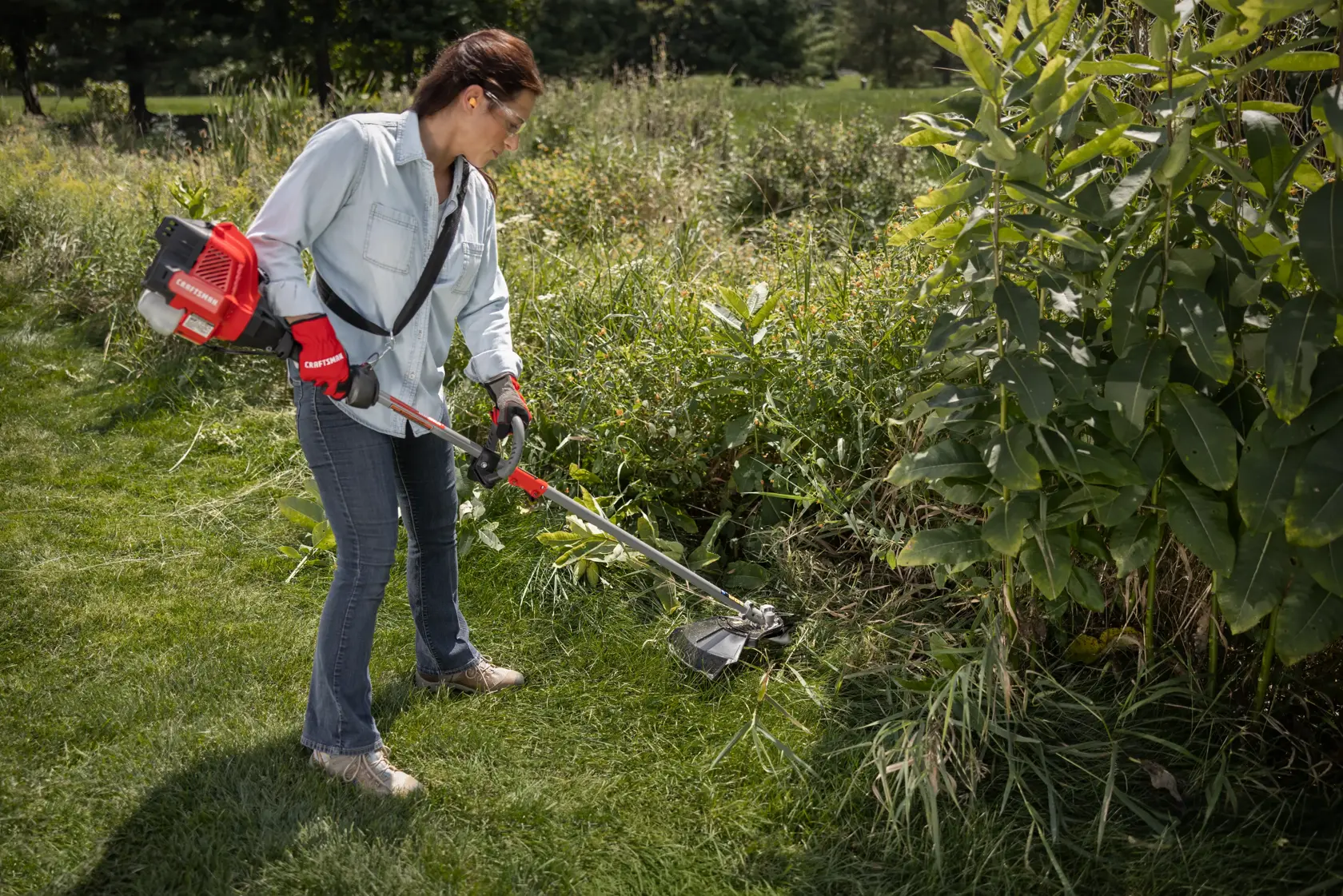 CRAFTSMAN Multi-Tool Attachment Brushcutter trimming around flowerbed